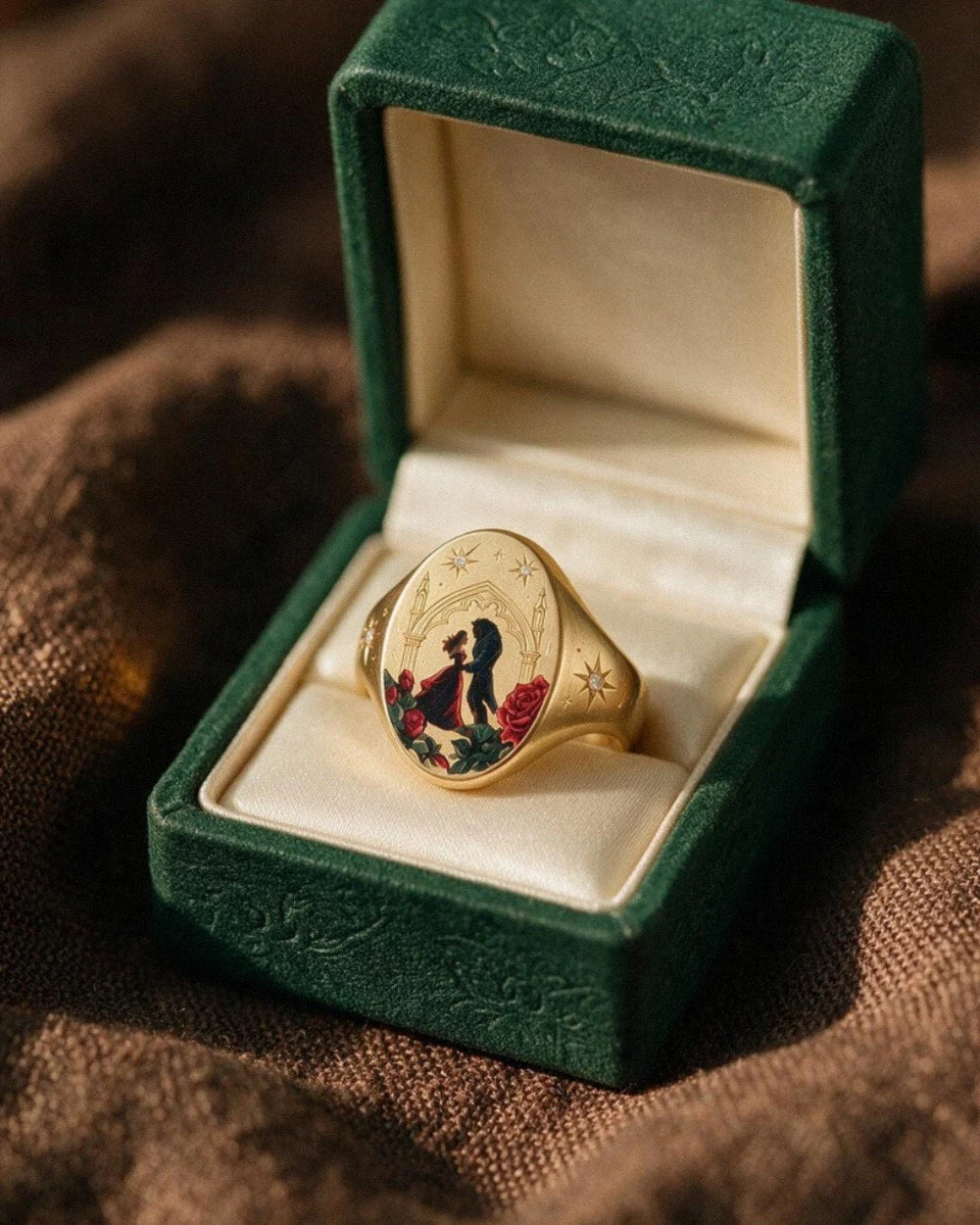 A portrait ring presented in an open green jewellery box