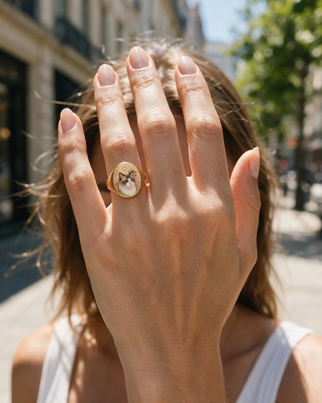A portrait signet ring worn on the hand
